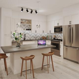A modern kitchen with a large island, stainless steel appliances, and stylish bar stools.