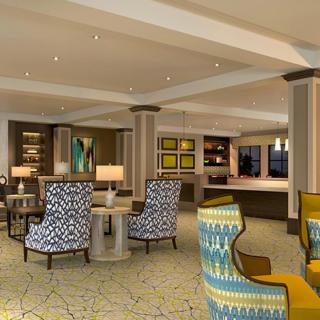 A modern hotel lobby with stylish seating and elegant decor.