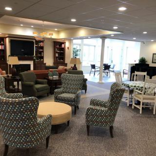 A cozy lounge area with comfortable seating and a television.