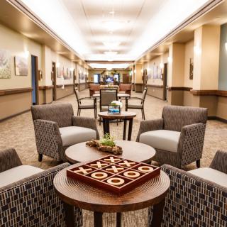 A spacious hotel lobby with comfortable seating arrangements and elegant interior design.