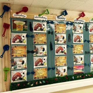 A classroom bulletin board displaying weekly lesson plans with colorful decorations.