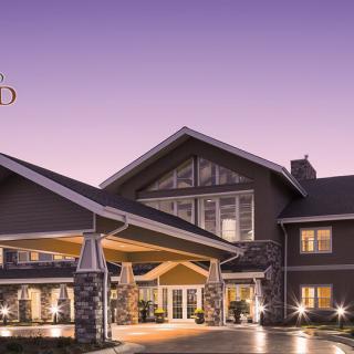 A beautifully lit hotel entrance during the evening.
