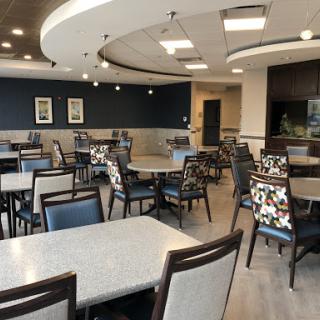 A modern dining area with elegant seating and a spacious layout.