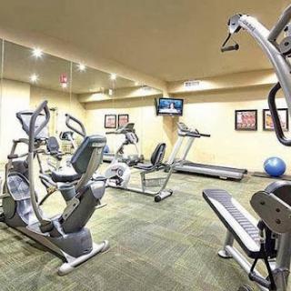 A well-equipped gym featuring various exercise machines for a complete workout.