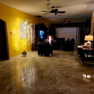 Cozy living room with decorative lights and warm tones.