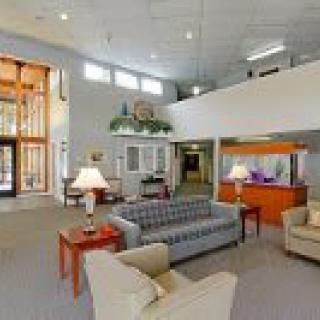 A spacious lobby with comfortable seating and a welcoming atmosphere.