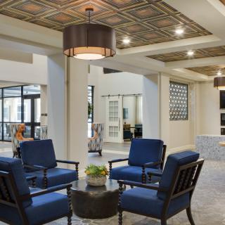 A modern lobby with comfortable seating and elegant lighting.