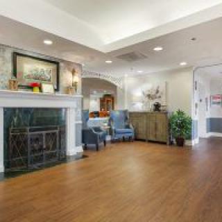 A cozy living room with a fireplace and comfortable seating.