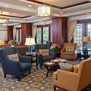 A cozy lounge area with comfortable seating and elegant decor.