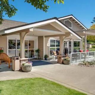 A charming single-story house with a well-maintained front yard and inviting entrance.
