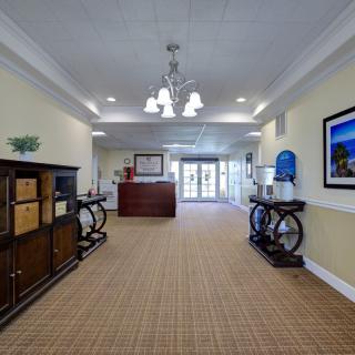 A well-lit lobby or reception area featuring elegant furniture and decor.