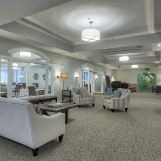 A luxurious lounge area with elegant seating and ambient lighting.