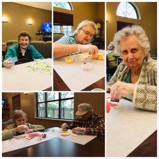 Seniors enjoying a crafting session at a community center.