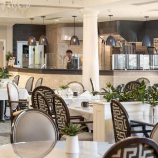 A modern restaurant interior with stylish seating and elegant decor.