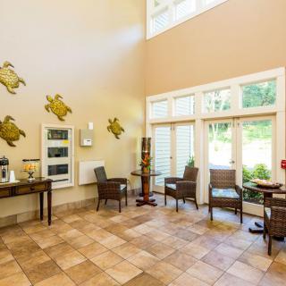 A welcoming lobby area with stylish furniture and decorative wall art.