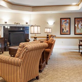 A cozy living room with stylish furniture and warm lighting.