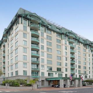 A multi-story residential apartment building with modern architectural design.