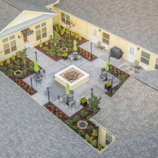 A beautifully designed courtyard with landscaped gardens and seating areas.