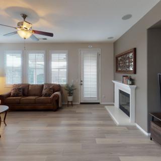 Cozy living room with a fireplace and comfortable seating.