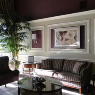 A cozy living room with elegant furniture and natural lighting.