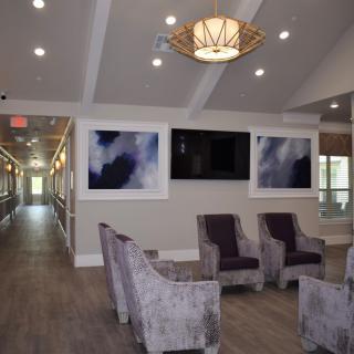 A modern lobby with comfortable seating and contemporary artwork.