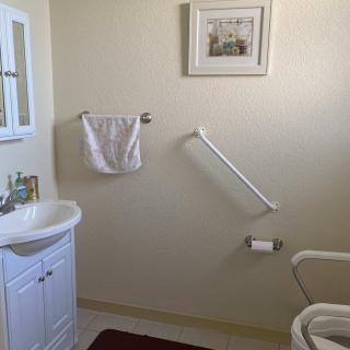 A clean and organized bathroom with essential amenities.