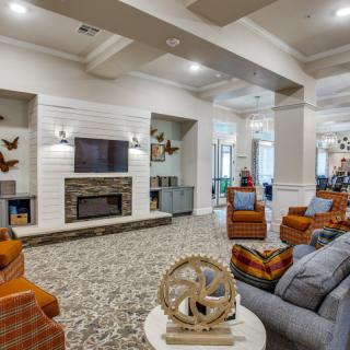 A modern living room with a fireplace, comfortable seating, and stylish decor.