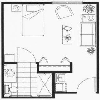 A floor plan of a compact studio apartment featuring a bedroom, bathroom, and living area.