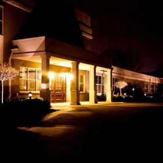 A well-lit building entrance at night.