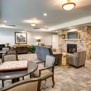 Cozy living room with a stone fireplace and comfortable seating.
