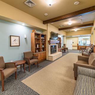 A cozy lobby area with comfortable seating and warm lighting.