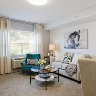 A modern and cozy living room with stylish furniture and decor.