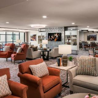 A modern and cozy lobby area with comfortable seating and stylish decor.