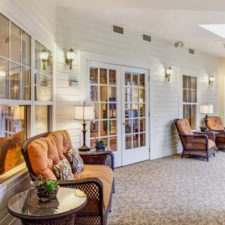 A cozy seating area with comfortable chairs and warm lighting.