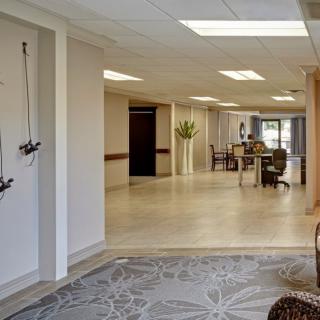 A modern and spacious lobby area with seating and a reception desk.