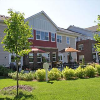 A beautiful residential complex featuring modern architecture and well-maintained landscaping.