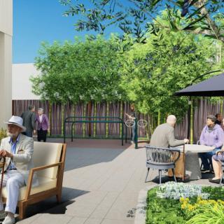People enjoying a relaxing day in an outdoor garden patio.