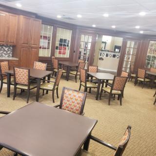 A well-organized dining area with multiple tables and chairs.