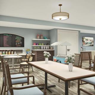 A modern cafe interior with tables, chairs, and decorative shelves.