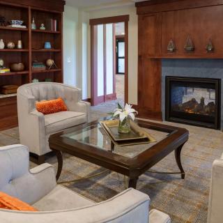 Cozy living room with a fireplace and elegant furniture.