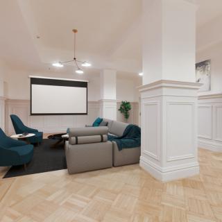 A modern living room featuring comfortable seating, a projector screen, and elegant decor.