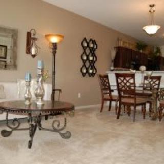 A cozy living and dining area featuring elegant furniture and tasteful decor.