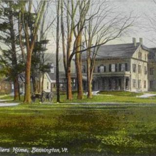 A vintage postcard depicting an historic house surrounded by trees.
