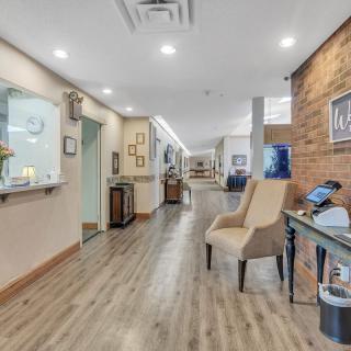A modern office waiting area with comfortable seating and sleek design elements.