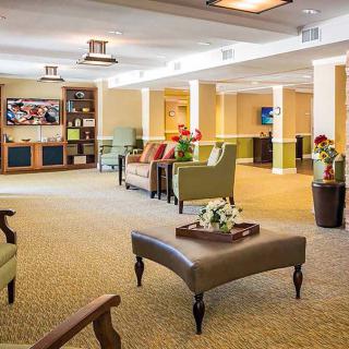 A spacious and modern lounge with comfortable seating and elegant decor.
