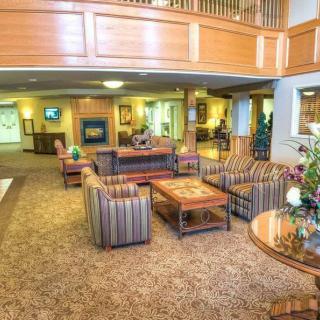A spacious hotel lobby with comfortable seating and elegant decor.