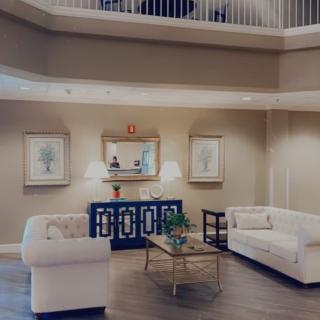 A stylish and modern living room with elegant furniture and decor.