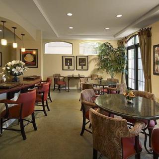 A cozy lounge area with elegant furniture and soft lighting.
