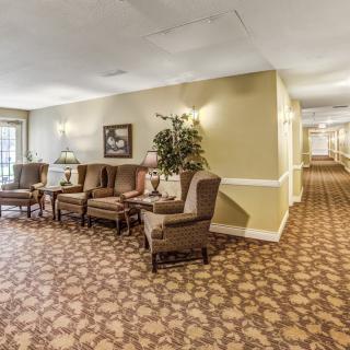 A cozy lobby area with comfortable seating and decorative elements.