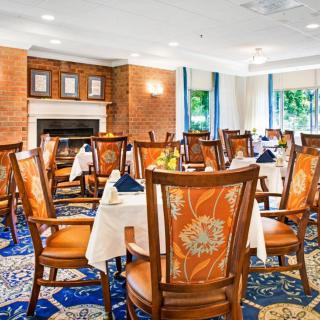A well-decorated restaurant dining room with elegant furniture.